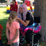 Face painting festival fun Giggle Loopsy Denver area clown